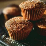 Bakery style gingerbread muffins with a sprinkle of cinnamon and sugar