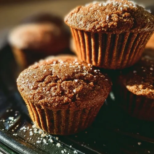 Bakery style gingerbread muffins with a sprinkle of cinnamon and sugar
