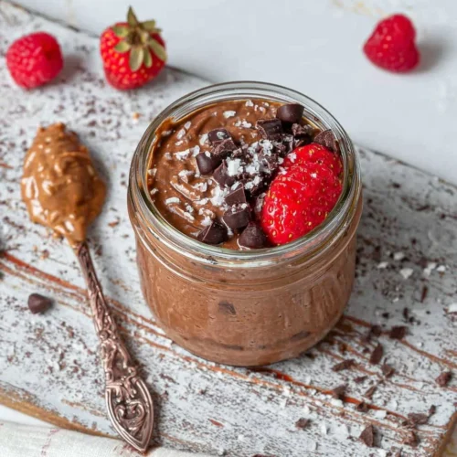 Delicious brownie batter overnight oats in a bowl with toppings