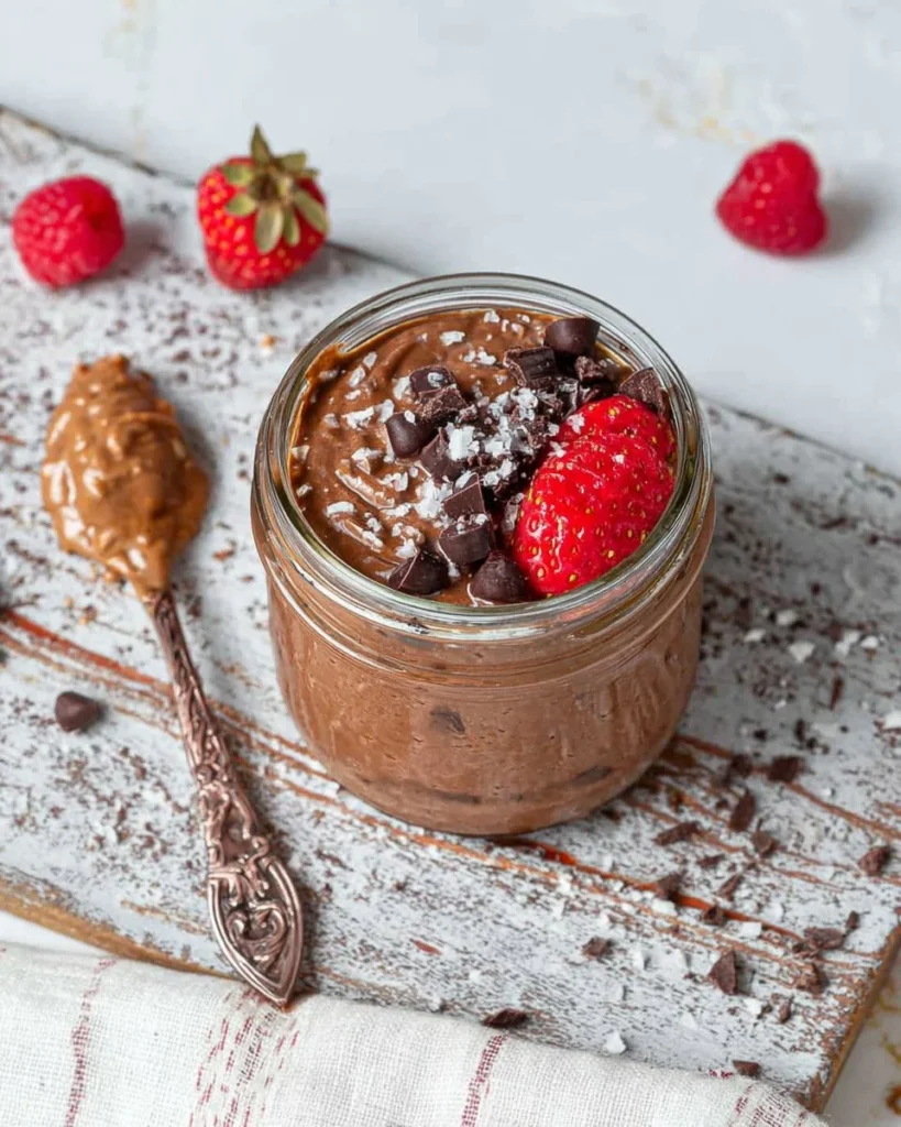 Delicious brownie batter overnight oats in a bowl with toppings