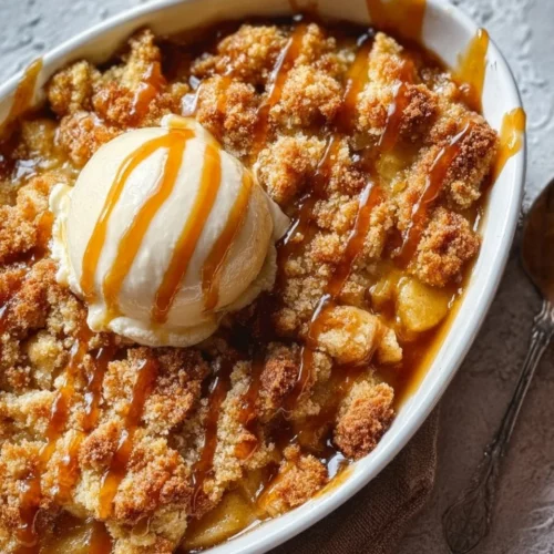 Delicious Caramel Apple Dump Cake topped with caramel and apple slices