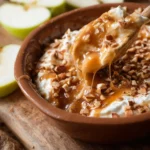 Cream cheese caramel apple dip served with apple slices for dipping