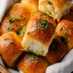 Homemade garlic bread rolls fresh out of the oven, golden and fluffy