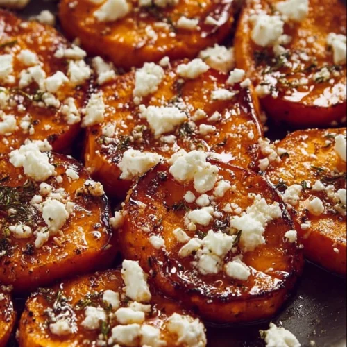 Delicious gourmet honey feta sweet potato rounds served as a savory appetizer.