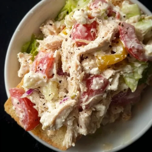 Delicious Italian Grinder Chicken Salad featuring fresh ingredients and seasonings.